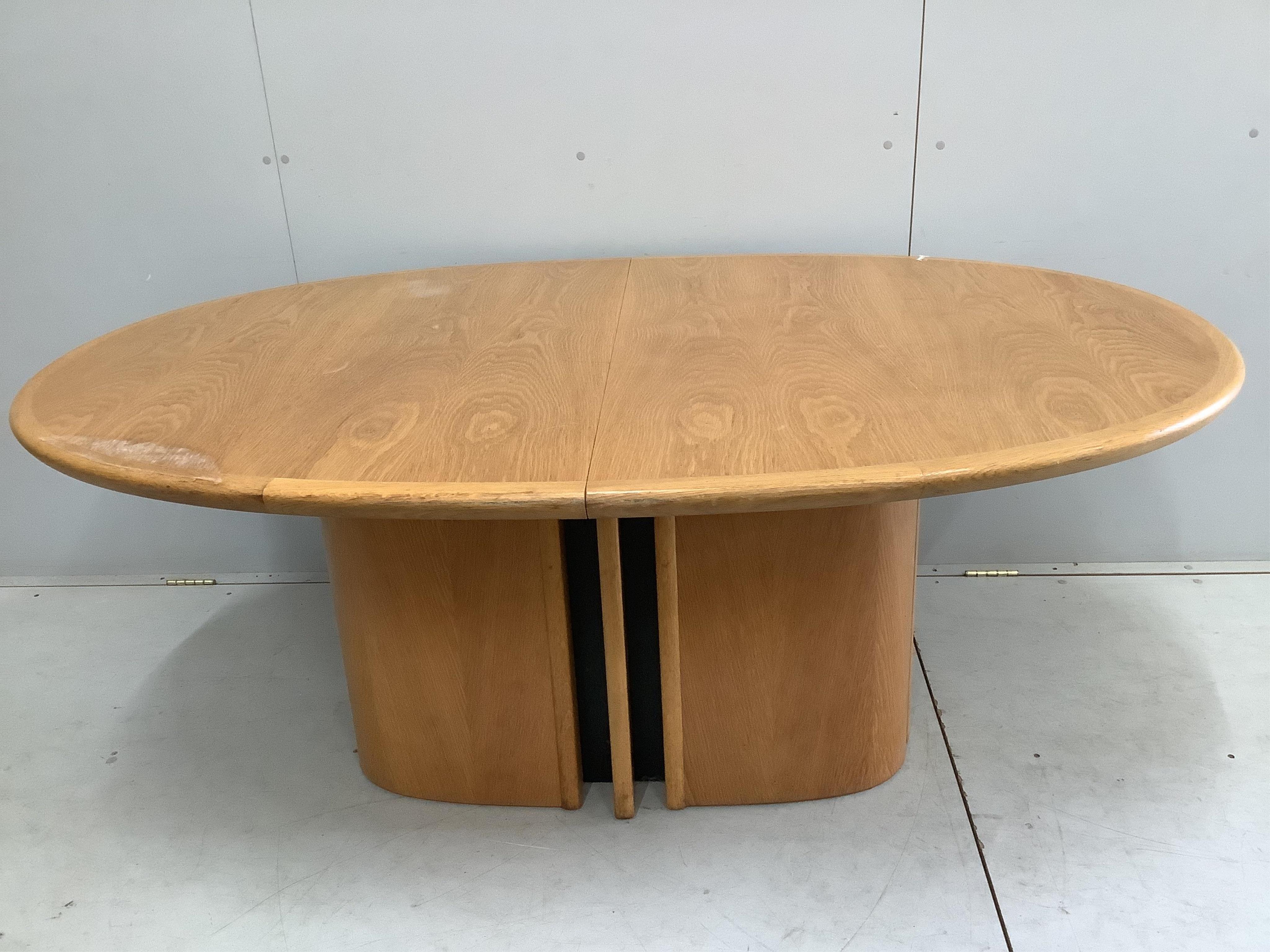 A Skovby oak extending dining table, 250cm extended, depth 108cm, height 72cm